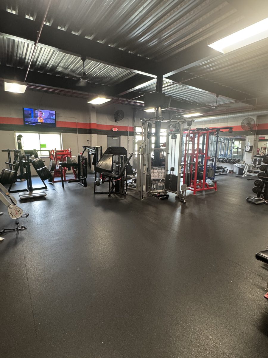 The open main floor with cable stations, racks and a wall-mounted TV