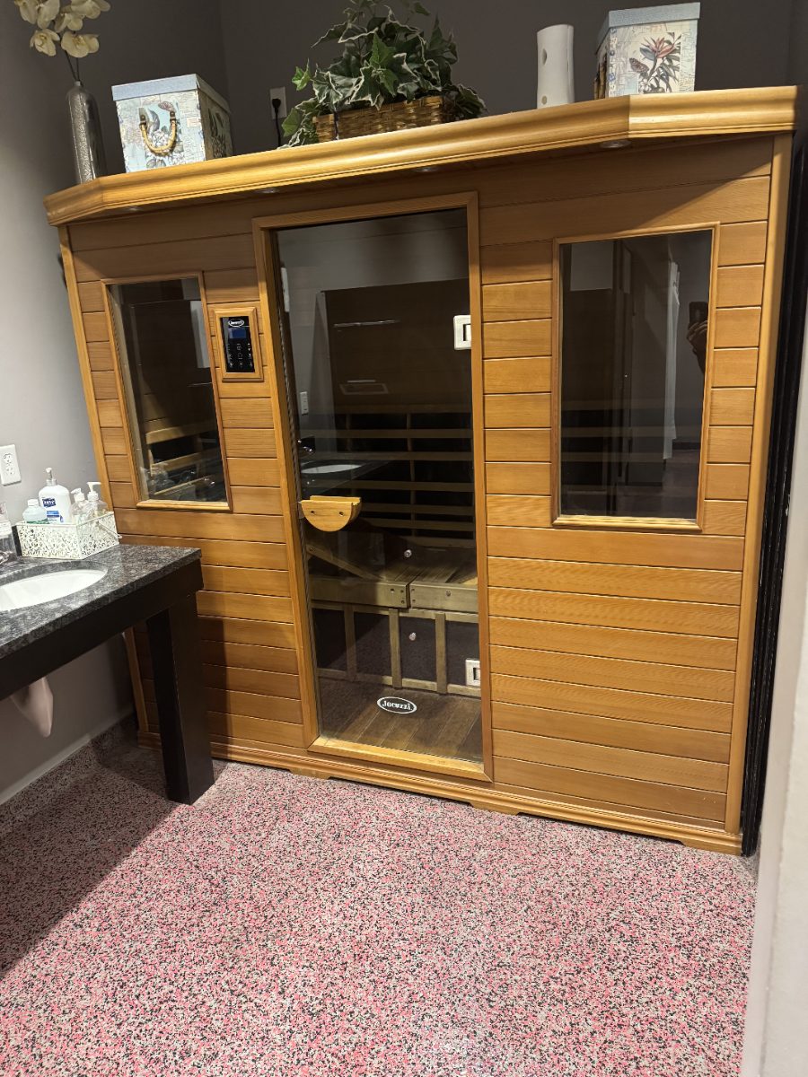 The cedar infrared sauna beside the vanity